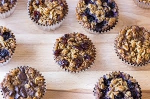 oatmeal muffins with different toppings on a cutting board