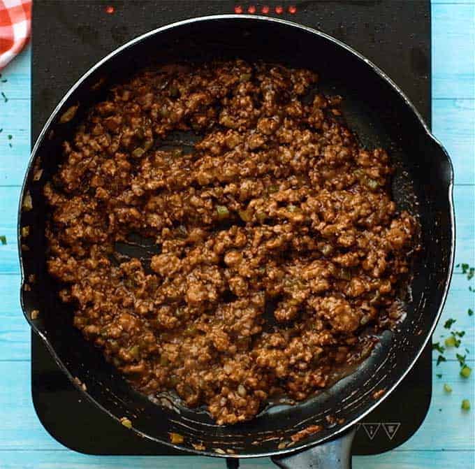 Skillet full of homemade sloppy Joe meat mixture.