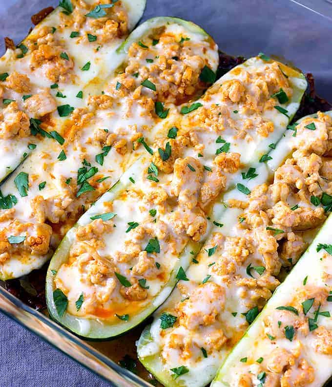 baking dish full of cooked Buffalo Chicken Zucchini Boats