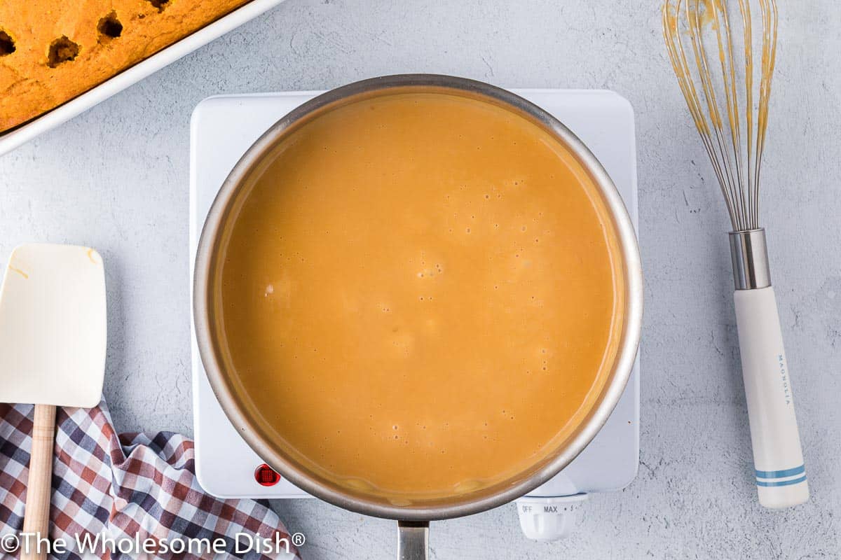 Butterscotch pudding cooking in a pot.