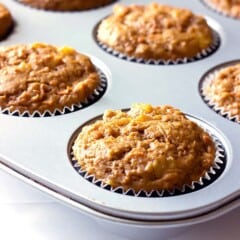 muffin tin full of carrot cake muffins