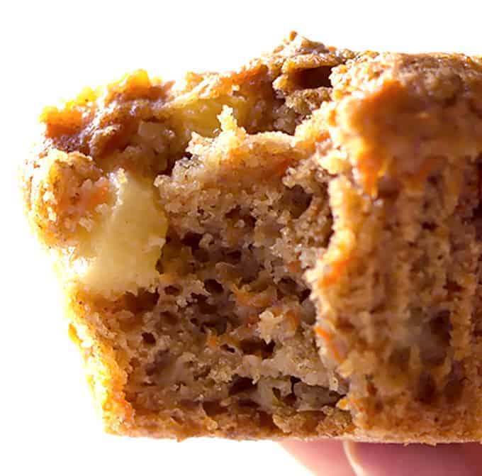 close up of a bite taken out of a Carrot Cake Muffins