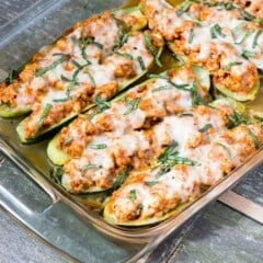 baking dish full of cooked Chicken Parmesan Zucchini Boats