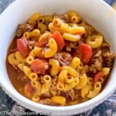 White bowl full of chili mac.