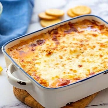 Baking dish full of hot cheesy buffalo chicken dip