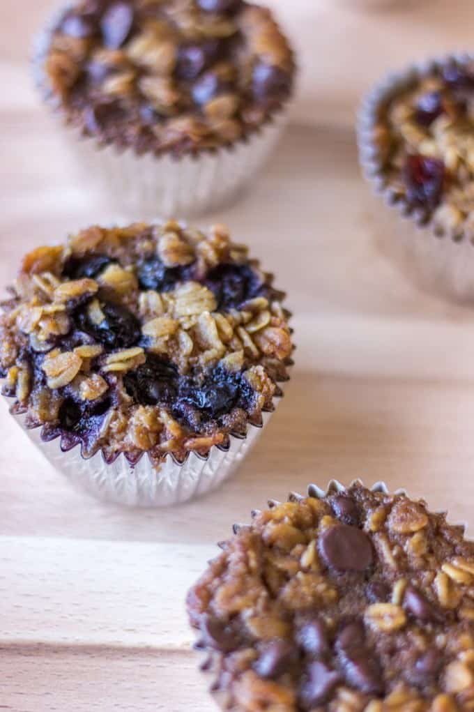 To-Go Baked Oatmeal with different Toppings on a cutting board