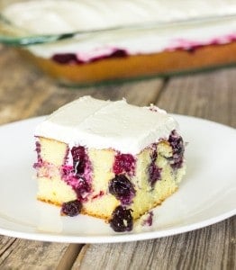 slice of Blueberry Lemon Poke Cake on a plate