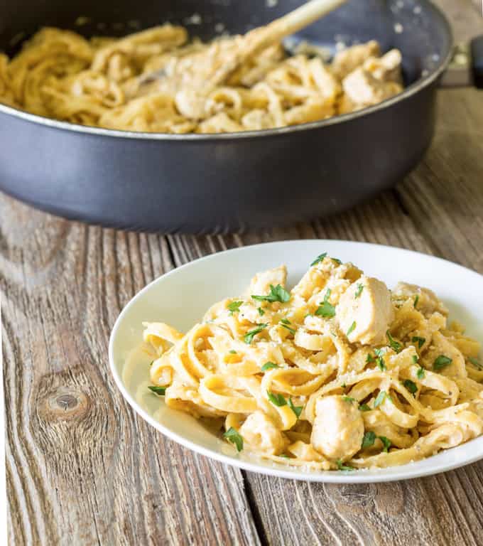 white bowl full of One Pot Cajun Chicken Alfredo