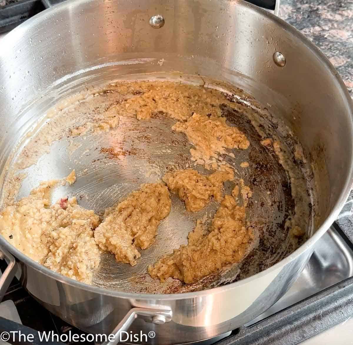 A roux cooking in a pot.