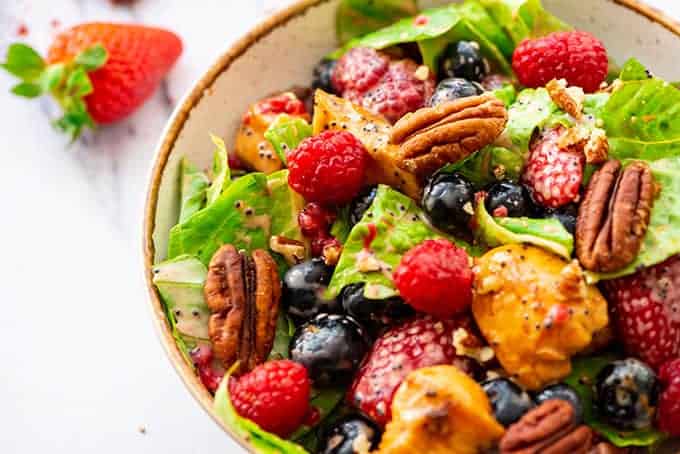 Poppyseed Berry Salad with chicken in a bowl