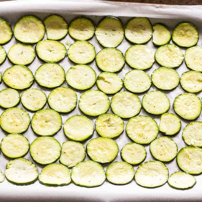 baking sheet full of sliced Zucchini Chips