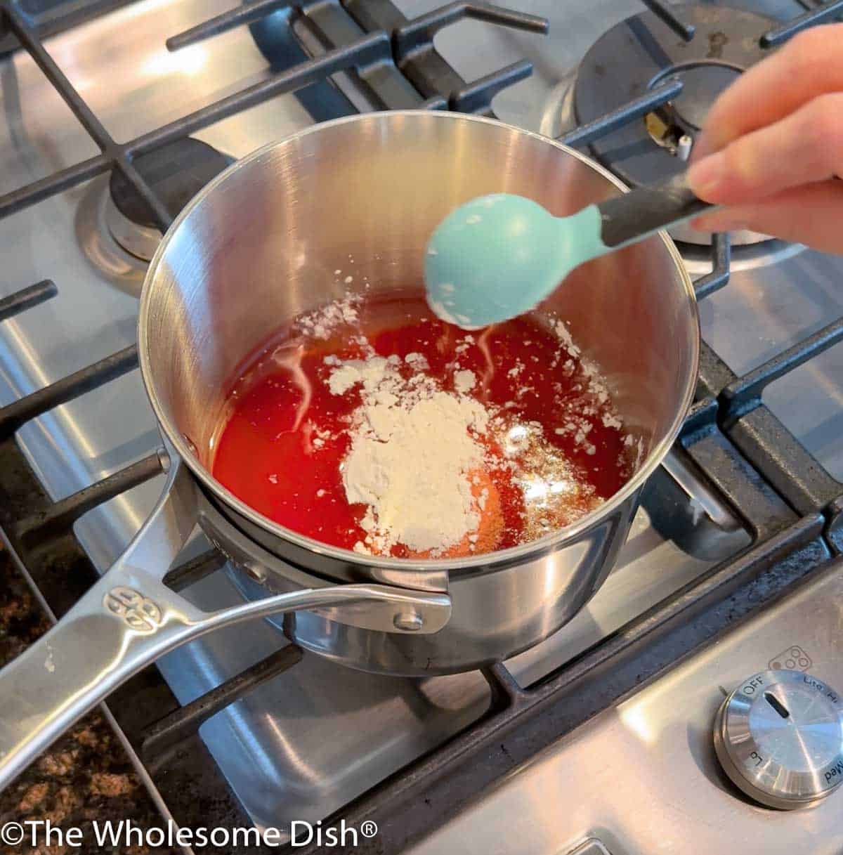 Pot with sugar, water, jell-o, and corn starch.