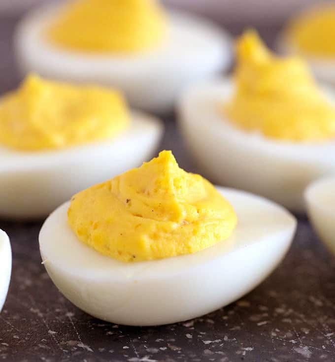 Deviled eggs on a cutting board