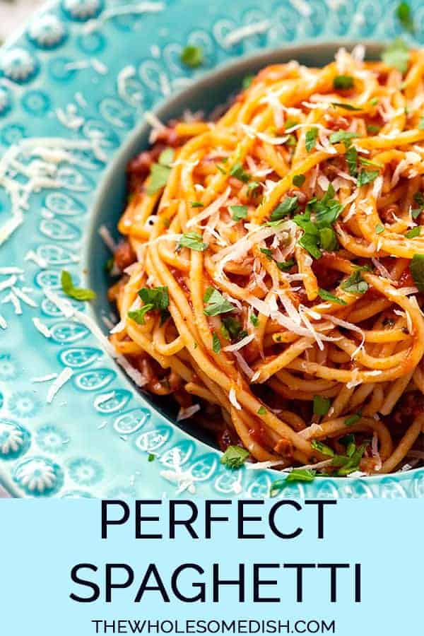 spaghetti with meat sauce in a blue bowl with text overlay