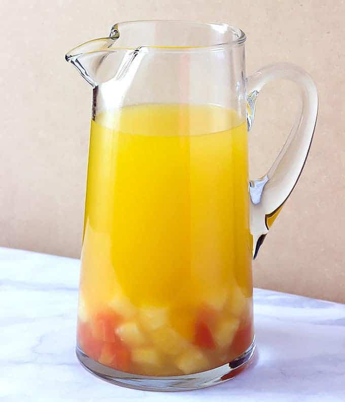 glass pitcher full of Tropical Sangria