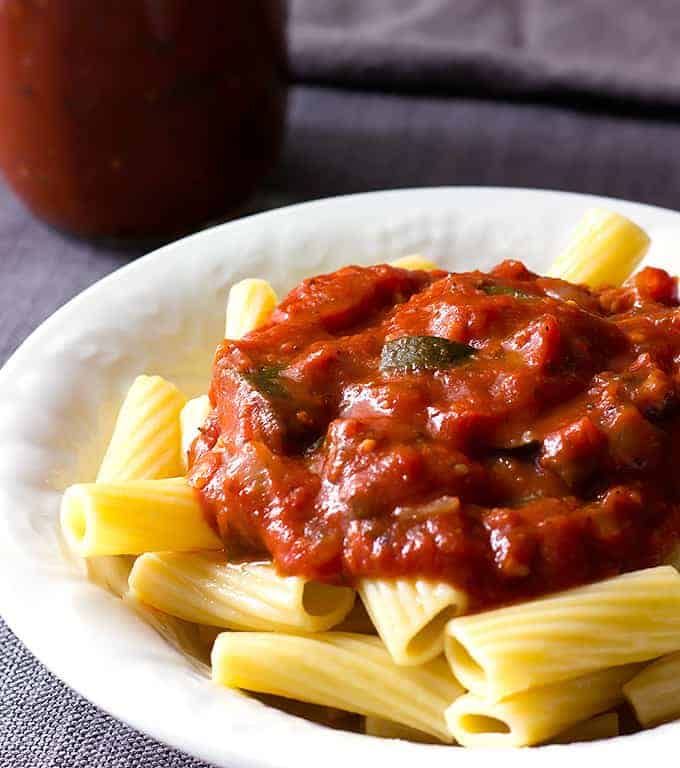 white bowl full of pasta topped with Zucchini Mushroom Pasta Sauce